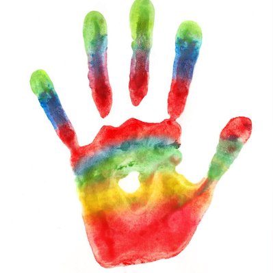 Multicoloured rainbow handprint on white background  