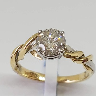 Beautiful diamond and gold engagement ring on white background