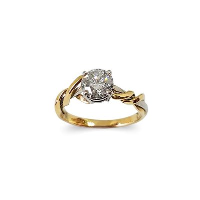 Beautiful diamond and gold engagement ring on white background