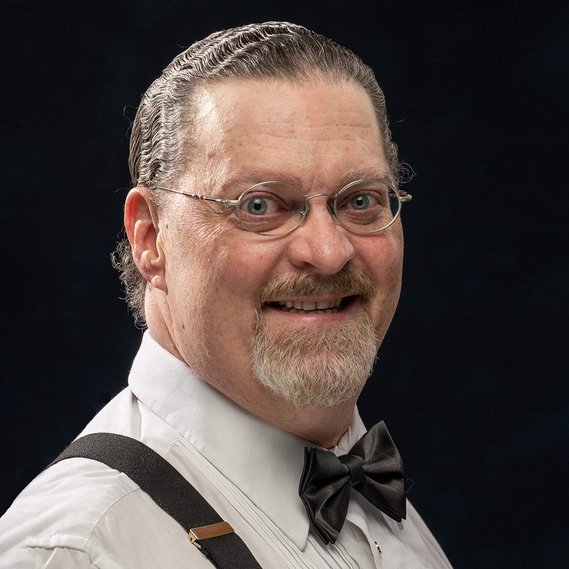 Linkedin-style headshot in Ottawa on a black background of Johnny Vegas by Frank Fenn IDEA3