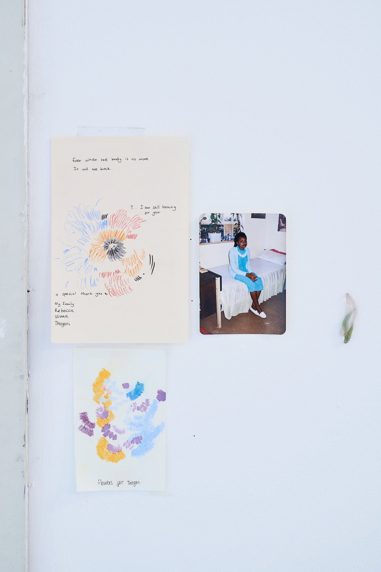 Handwritten note, photograph of my mother, drawing on paper and hand cut and coloured glass.