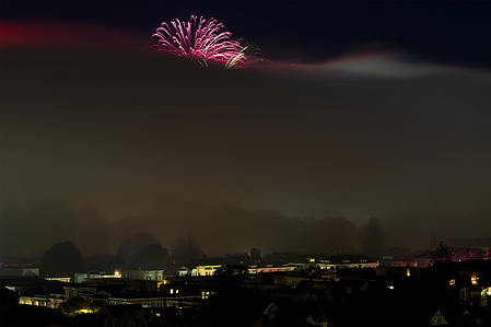 A photograph of one lone firework breaking through the thick fog on July 4th in San Francisco, where festivities are typically snuffed out by Mother Nature.