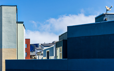 A view from the Octavia/Fell Street offramp of 101 of layers of San Francisco buildings looking painterly.