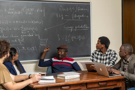 Dr. Martial Longla, a UM mathematics professor and his graduate students in Hume Hall. Photo by Srijita Chattopadhyay&amp;amp;#x2F; Ole Miss Digital Imaging Services