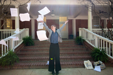 Kaleigh Breisch, a student at the Croft institute of International Studies, tosses pages of her thesis in celebration of passing her defense on May 3, 2023. Photo by Srijita Chattopadhyay&amp;amp;amp;amp;amp;#x2F; Ole Miss Digital Imaging Services
