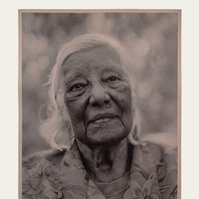 monotone portrait of elder Australian indigenous woman, head and shoulders, wizened face, soft look