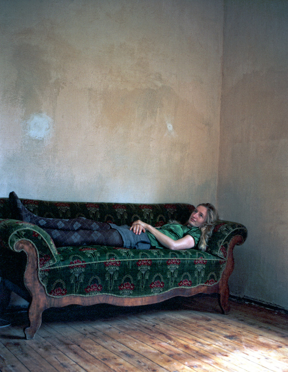 Woman laying on a couch
