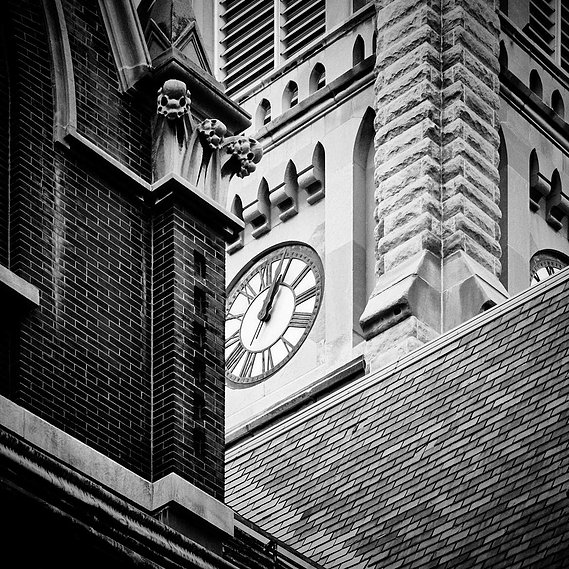 Clock tower surrounded by other brick buildings at various angles.  Prints for sale.  Architecture photography by Loren Scott Fiedler.