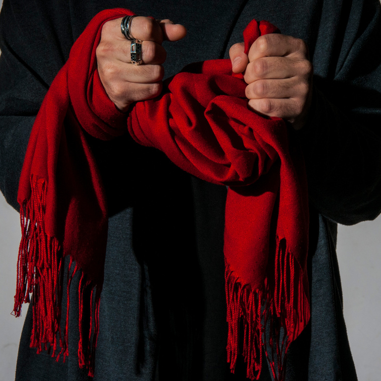 The Scarf
“For the longest while I wouldn’t circulate without this scarf around my neck, I became recognized by the presence of the red scarf… It became my signature, part of my identity. If I were to lose it all I’d save my identity.”