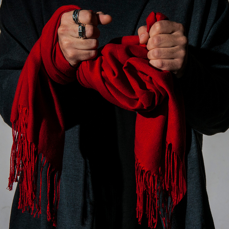 The Scarf
“For the longest while I wouldn’t circulate without this scarf around my neck, I became recognized by the presence of the red scarf… It became my signature, part of my identity. If I were to lose it all I’d save my identity.”