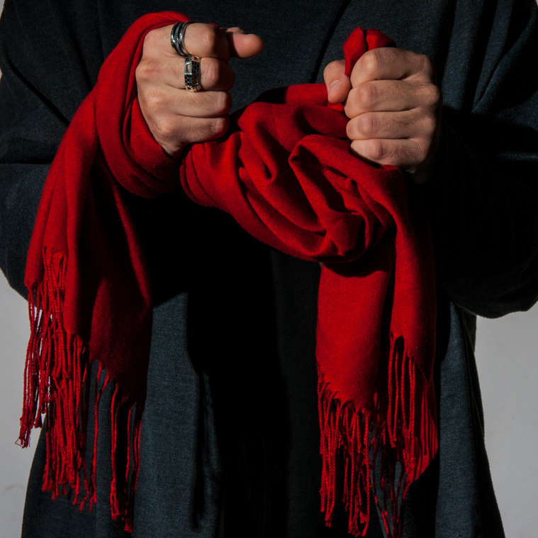 The Scarf
“For the longest while I wouldn’t circulate without this scarf around my neck, I became recognized by the presence of the red scarf… It became my signature, part of my identity. If I were to lose it all I’d save my identity.”
