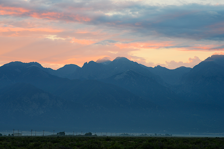 Crestone, CO seen with the mountains Challenger and Kit Carson behind it.