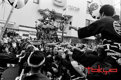 People carrying a mikoshi at the Kichijoji Matsuri in Tokyo Japan.