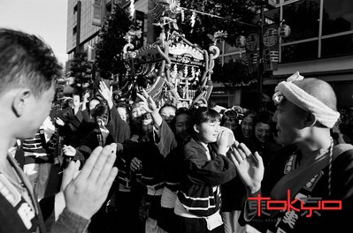 People carrying a mikoshi at the Kichijoji Matsuri in Tokyo Japan.