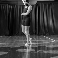 Black and white dancer pose on gym floor