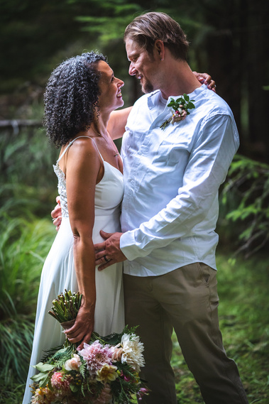 Bride and groom embracing on their wedding day in the San Juan Islands