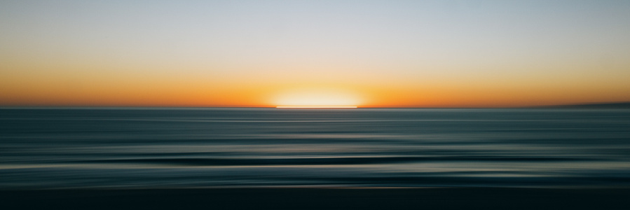 A panoramic view of sunset over the Pacific Ocean. 