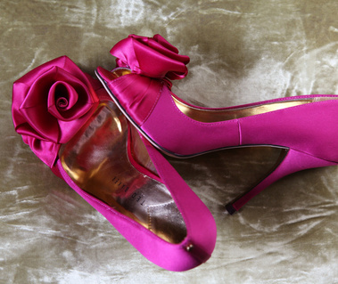 Wedding day reportage style photography: Close up of brides pink wedding shoes