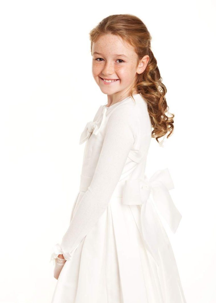 First Holy Communion Portrait of young girl taken in Professional Family Photography Studio with white background