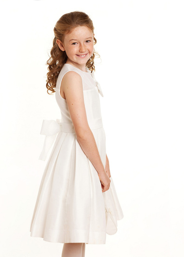 First Holy Communion Portrait of young girl taken in Professional Family Photography Studio with white background