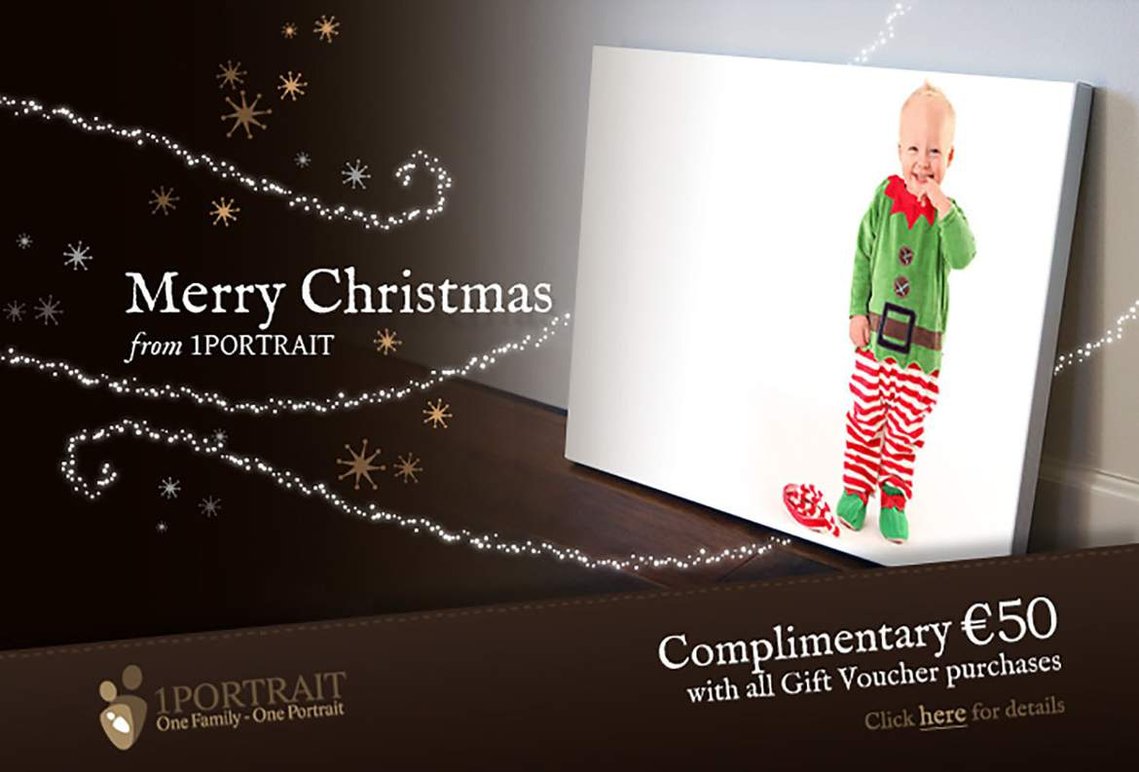 Christmas portrait of young blonde boy wearing elf costume in professional family portrait photography studio with white background offering Photography Gift Voucher Unique personal Christmas gift special offer