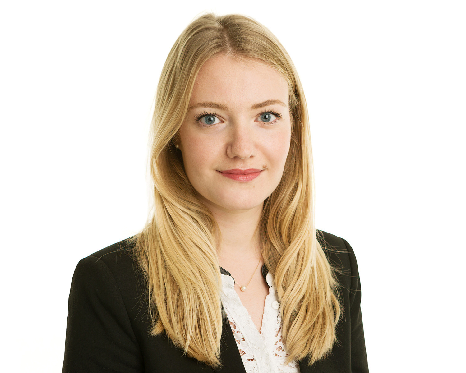 LinkedIn business headshot of young blonde female  in professional photography studio white  background