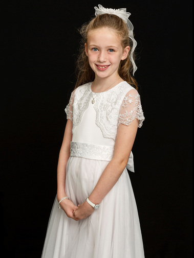 First Holy Communion Portrait of young girl taken in Professional Family Photography Studio with black background