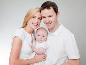 Family Portrait parents and new baby in professional photography studio Dublin