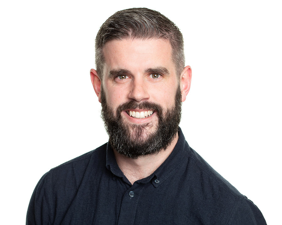 Professional photography studio headshot portrait of a young male businessman for LinkedIn