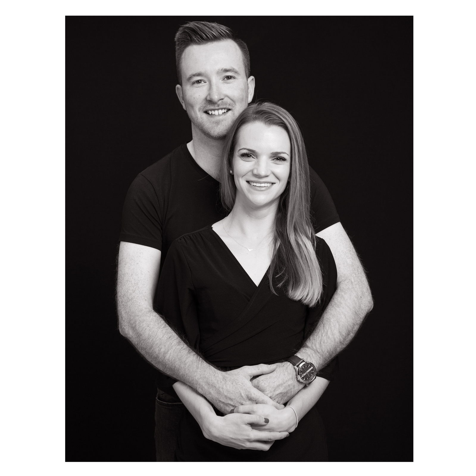Black and white professional engagement photo of young couple in photography studio Dublin 