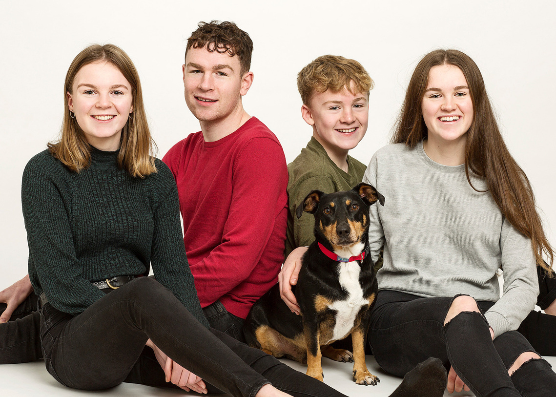 Sisters & brothers with dog in professional photography studio family portrait Pet photographer dublin 