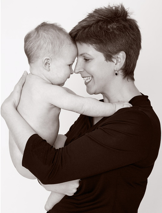 Close up portrait of mother holding infant baby in professional family photography studio Dublin 