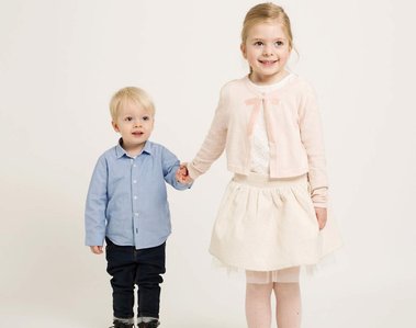 Professional portrait of young brother and sister holding hands in photography studio Dublin 