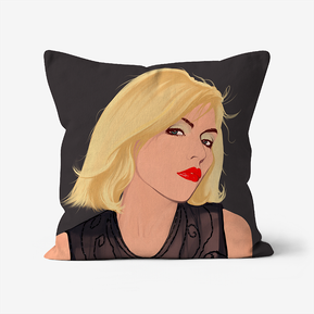 Faux Suede Throw Cushion Featuring Debbie Harry of Blondie by Ryan hodge illustration.  Dark grey background, blonde hair, red lips.  Available in three sizes. 