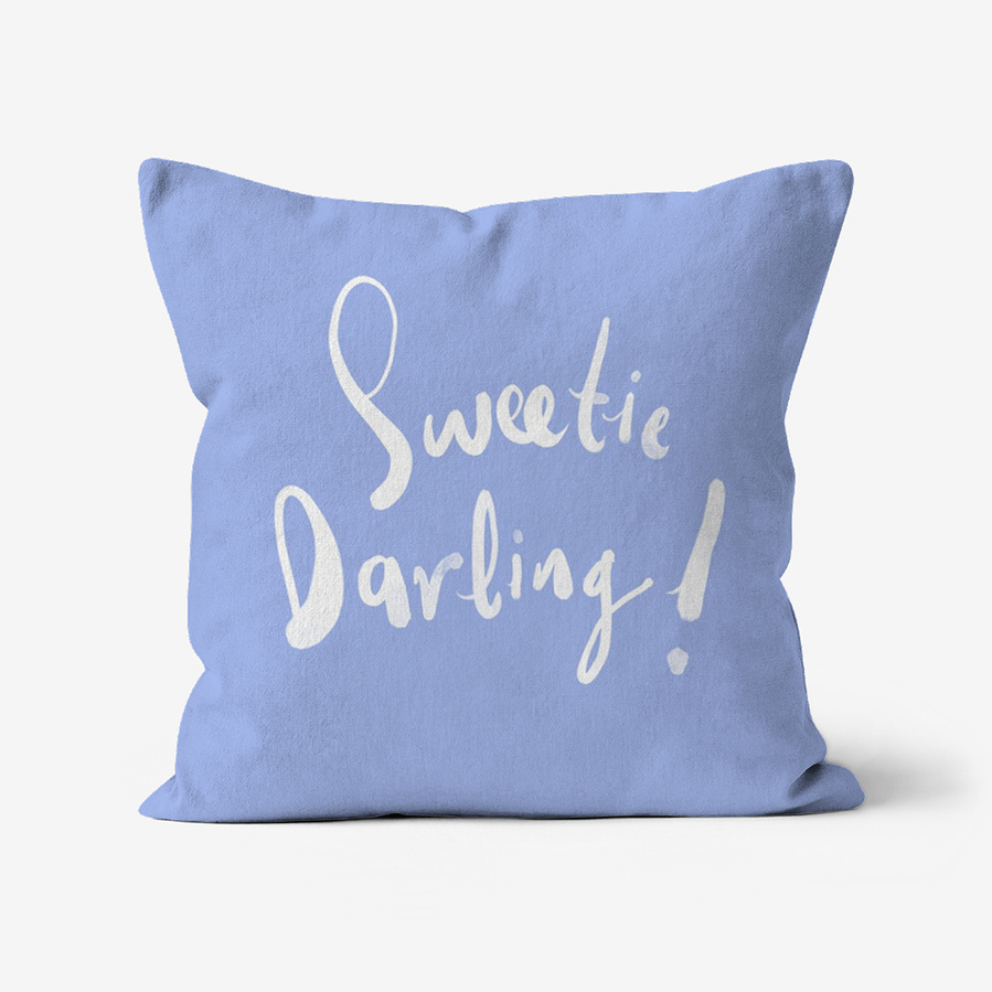 Faux suede throw cushion featuring a portrait of Edina Monsoon with catch phrase "Sweetie Darling!" on  the reverse  by Ryan Hodge illustration.  Available in various sizes.  