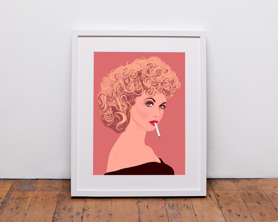 Framed fine art Giclée print of Olivia Newton-John as Sandy Olsson from the film Grease.  Artwork by Ryan Hodge illustration. She has curly blonde hair and off the shoulder top, red lips and smoking a cigarette.  peach background.  