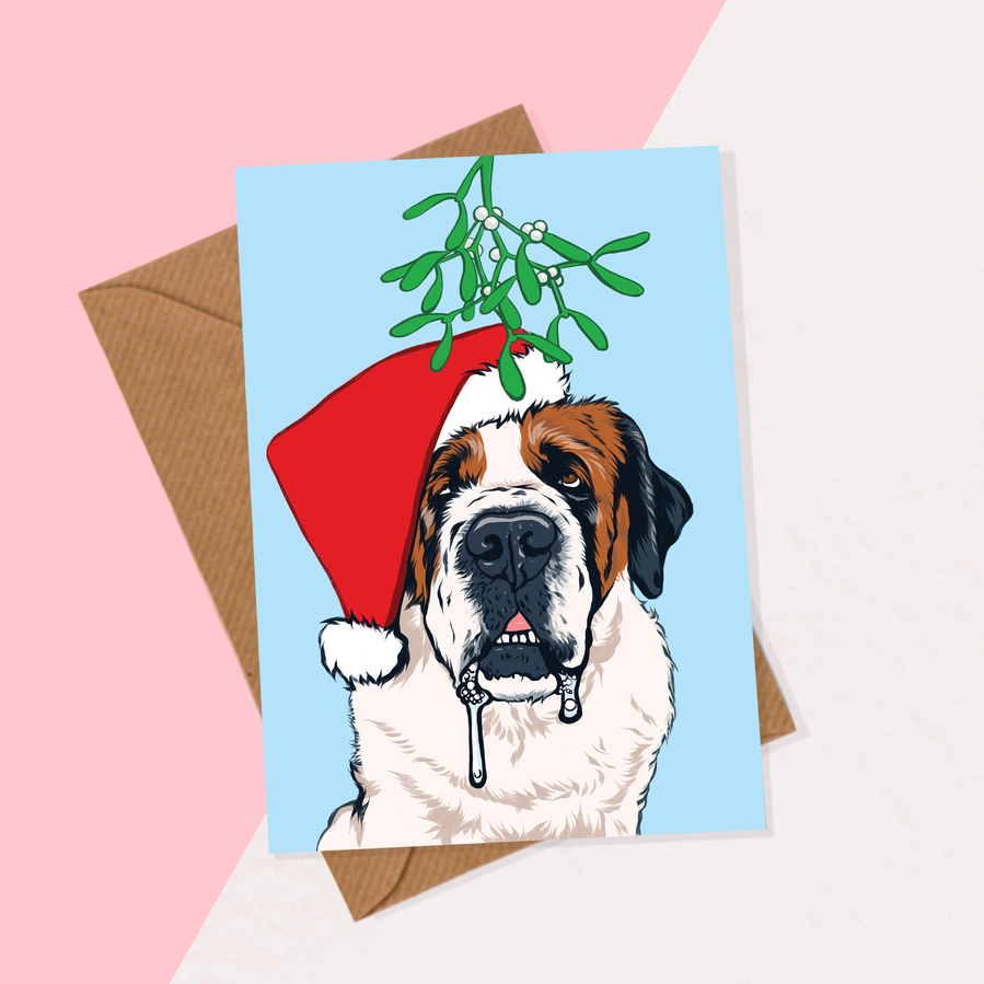 A6 Christmas Card featuring drooling Saint Bernard dog wearing Santa hat, expecting a kiss under the mistletoe.  
Available individually or as a multipack.  Comes with brown recycled paper envelope. 
