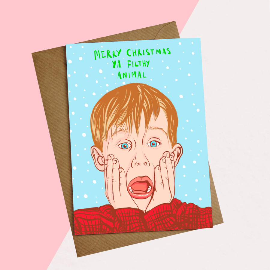 Macaulay Culkin is Kevin McCallister in Home Alone. Kevin is screaming, wearing a red jumper, on blue background with snow and slogan 'Merry Christmas ya filthy animal'.  