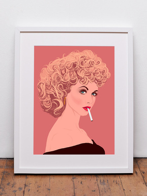 Pop and country singer and actor Olivia by Ryan Hodge illustration.  A framed fine art print available in various sizes and print only options. Sandy Olsson from Grease on peach background. The white frame with white mount sits on a bare wood floor. 