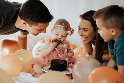 baby girl's 1st birthday Colorado milestone cake smash with family