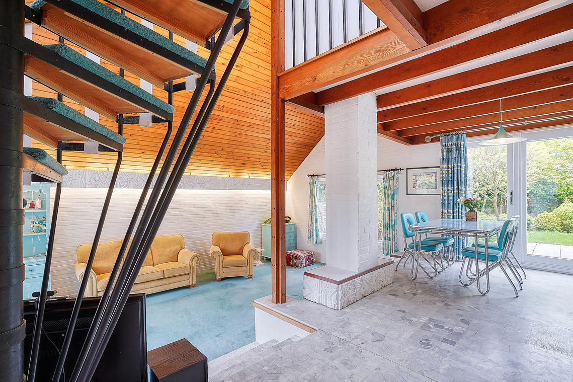 A beautiful 1960s detected chalet styled property with many original features still intact including a lovely spiral staircase which provides a very strong leading edge to this image.