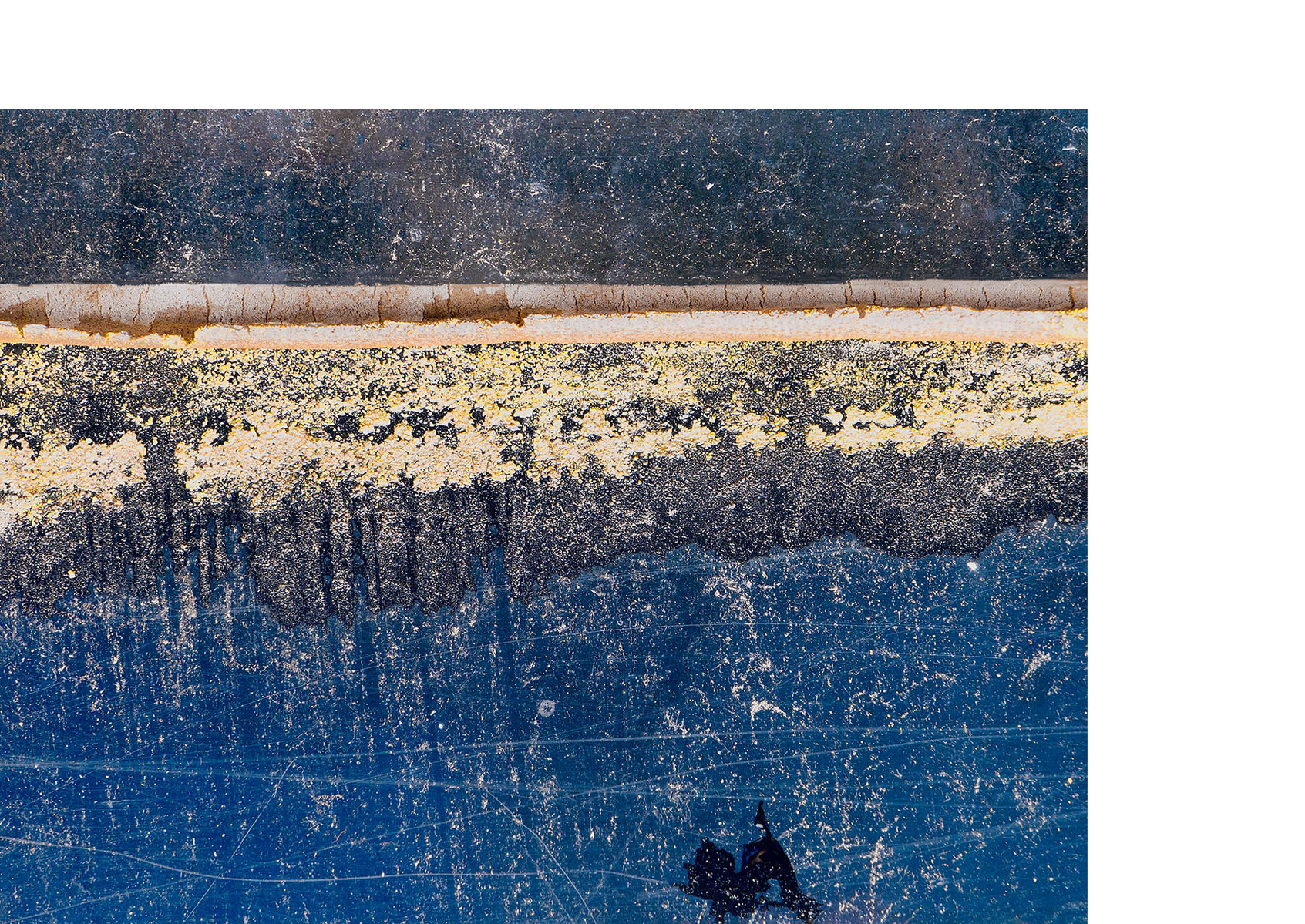 Marks on a wall that resemble a landscape