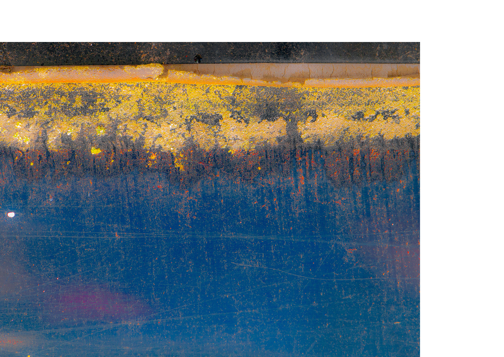 Marks on a wall that resemble a landscape