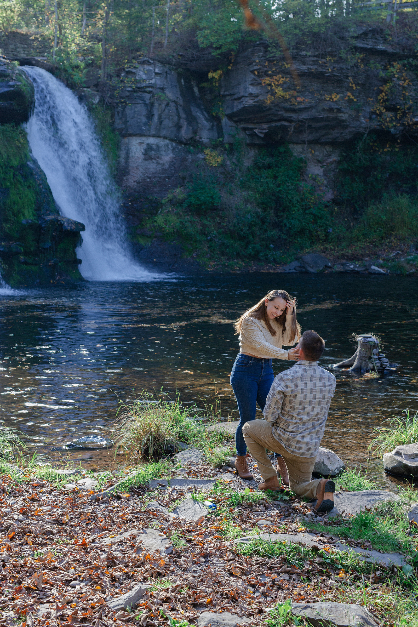 Surprise proposal and engagement couples session at Shinglekill Falls B&B in Purling New York Catskills with a luxury picnic.