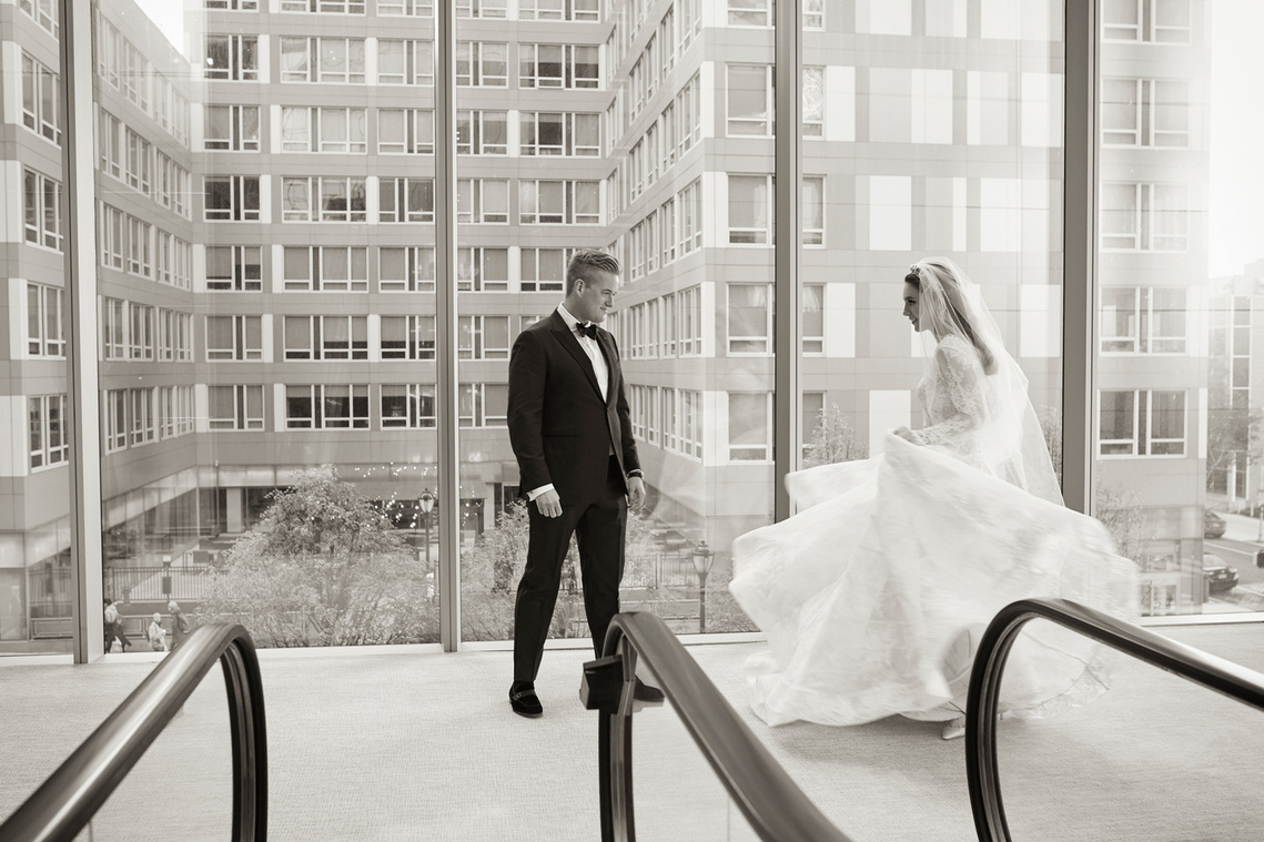 Drew and Cristina during their first look at their wedding at the Comcast Center in Philadelphia, Pennsylvania.