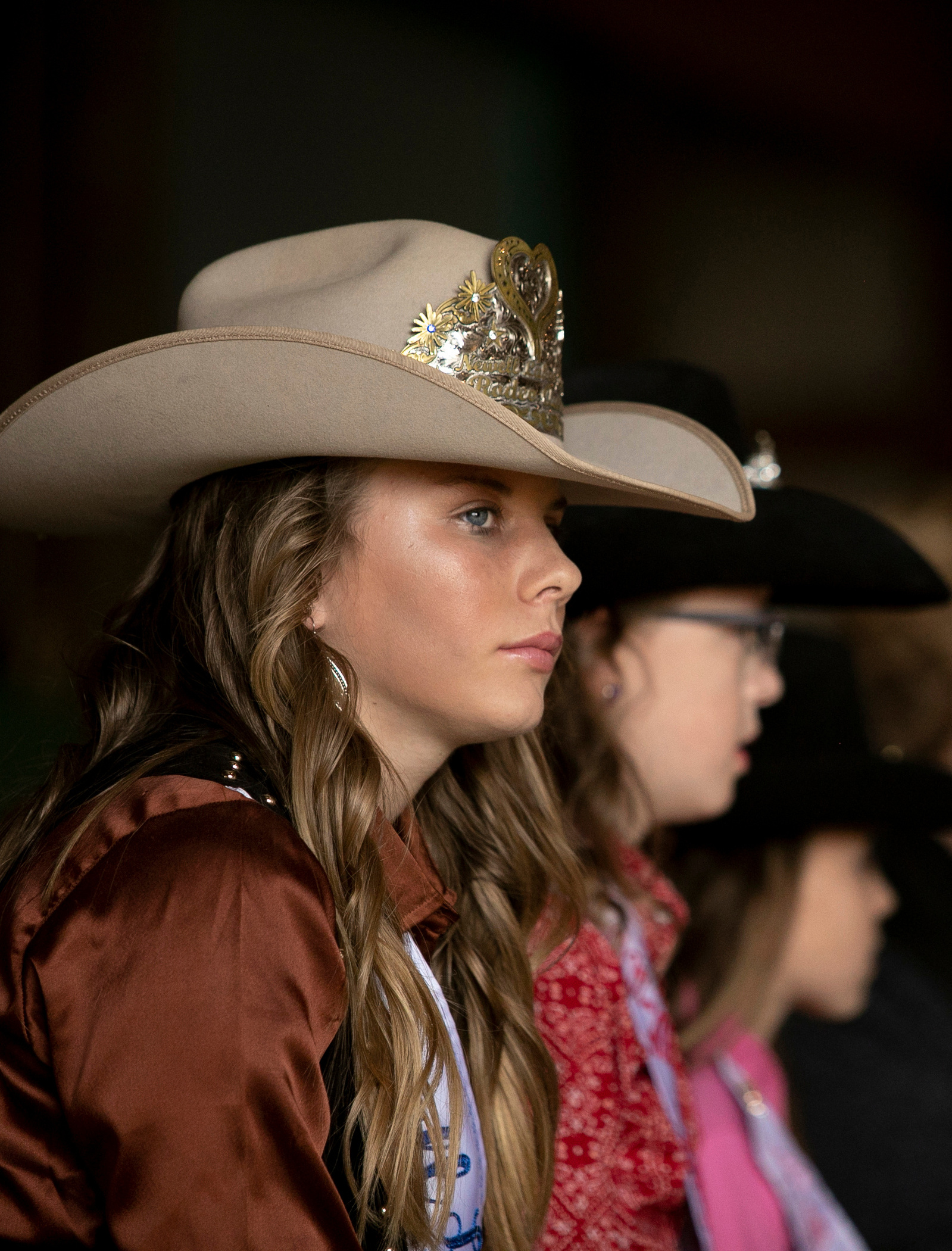 Aliceson Stranberg watches the 75th Newell Ram Sale while she wears the Miss Newell hat for the first time on Thursday, Sept. 17, 2020, in Newell S.D.