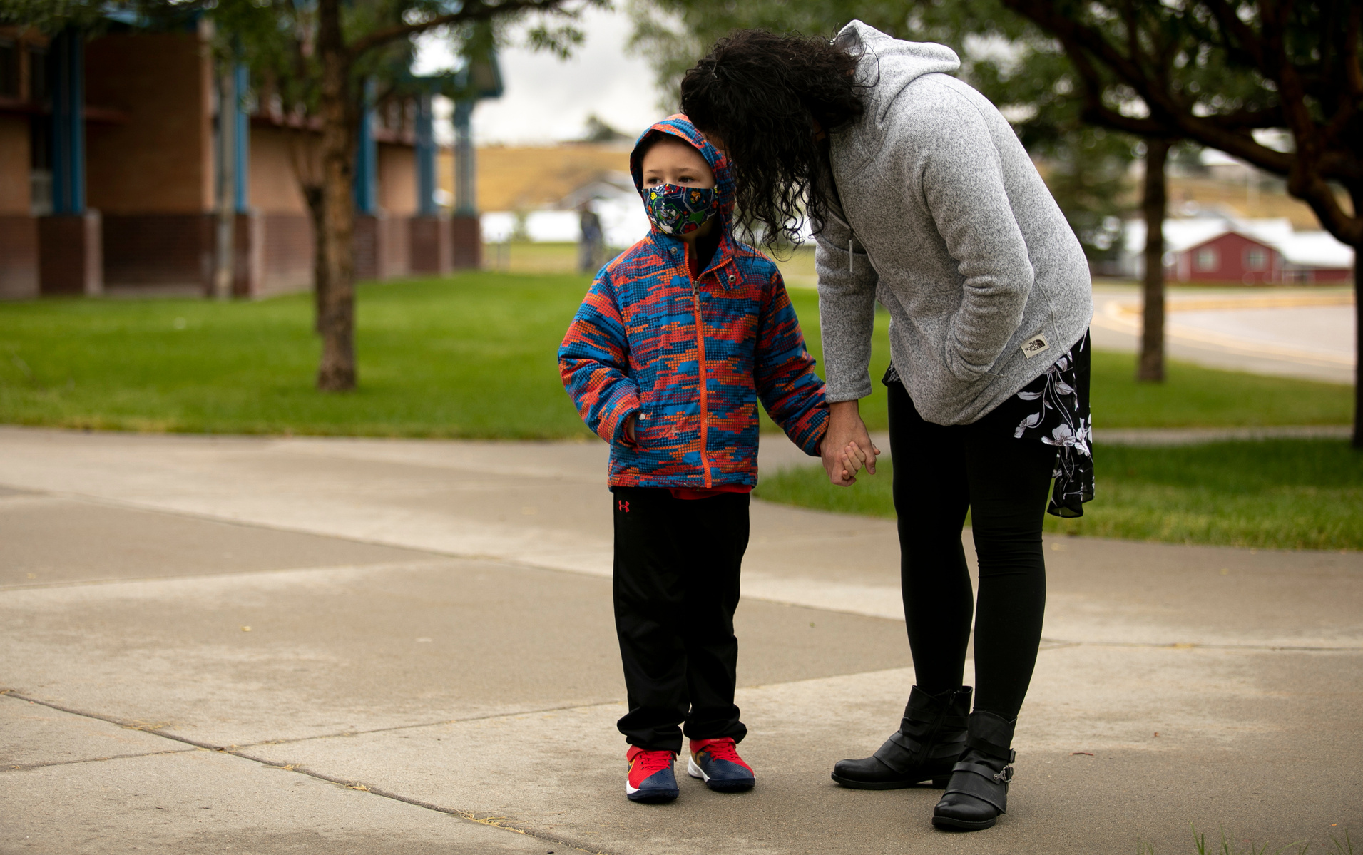 Laura Craig speaks to kindergartener Makai Craig, 5, before going into his first day of school at Valley View Elementary School on Tuesday, Aug. 26, 2020. Craig says she does not have many concerns about the pandemic. "My biggest concern is how the kids a