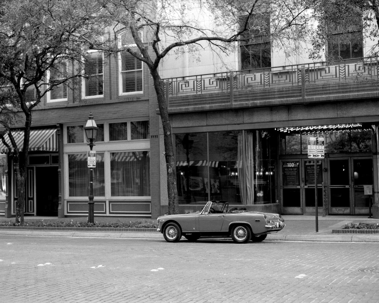 Photo of old car parked on street