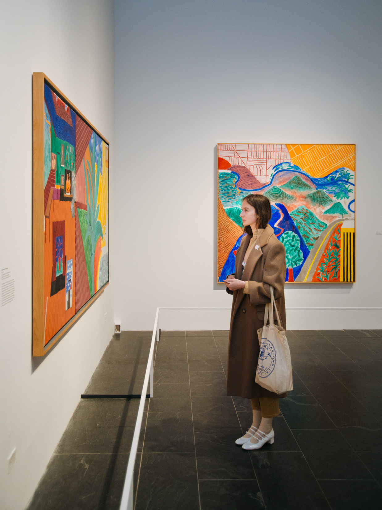 A viewer at the retrospective exhibition "David Hockney" at the Metropolitan Museum of Art. CREDIT: Charlie Rubin for The New York Times