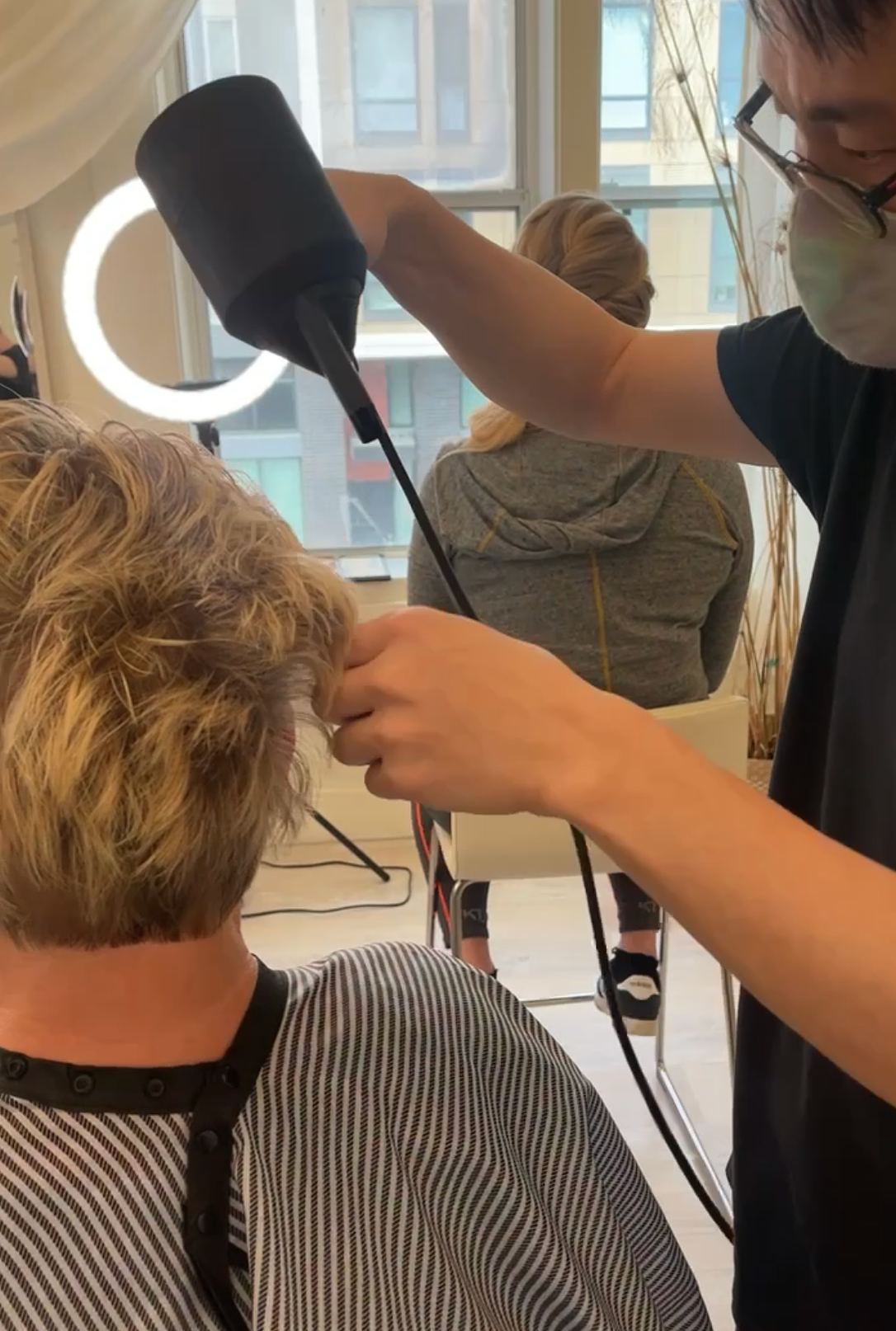 woman short hair blowdryer